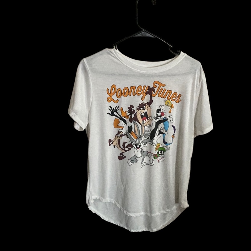 Looney Tunes white shirt with cartoon characters it on.
